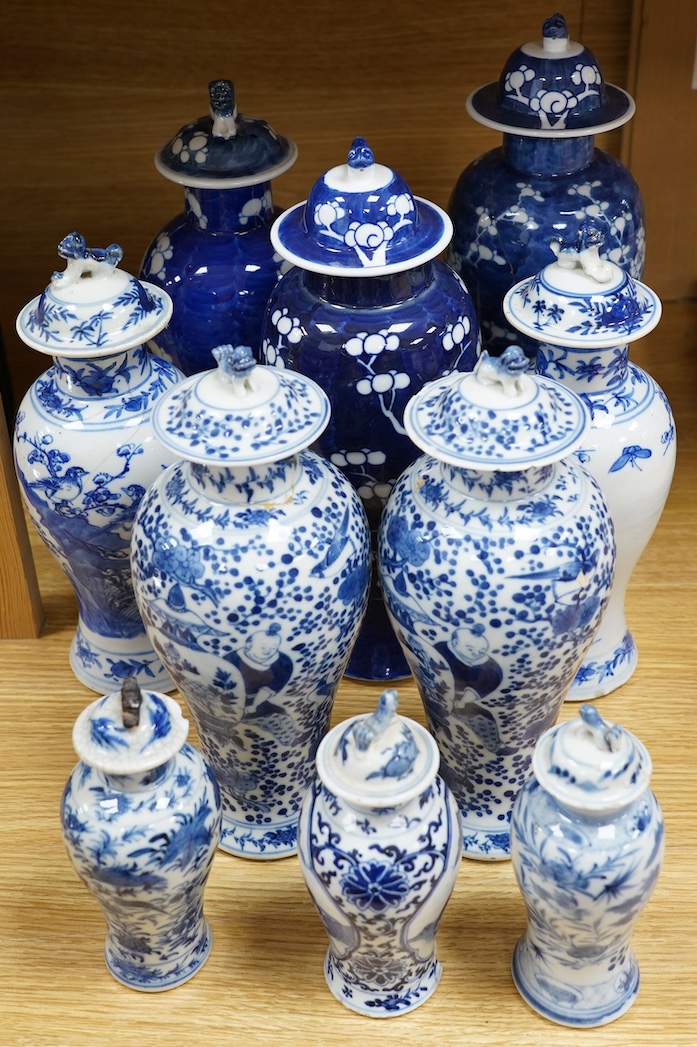 Ten Chinese blue and white baluster jars and covers including prunus flower examples, 19th century and later, tallest 35cm. Condition - poor to fair
